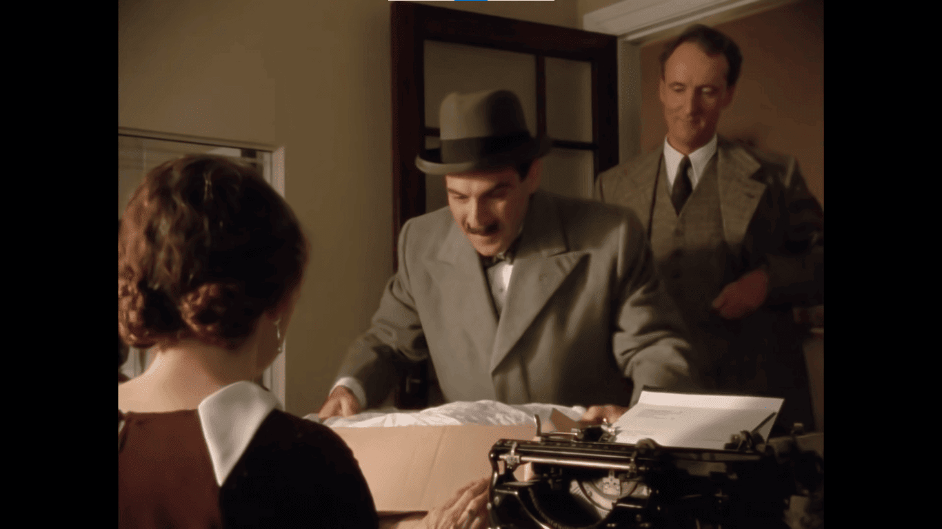 ポワロのプレゼント ミスレモンにプレゼントを贈るポワロ